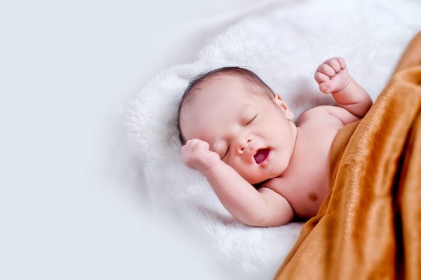 A tired baby yawning