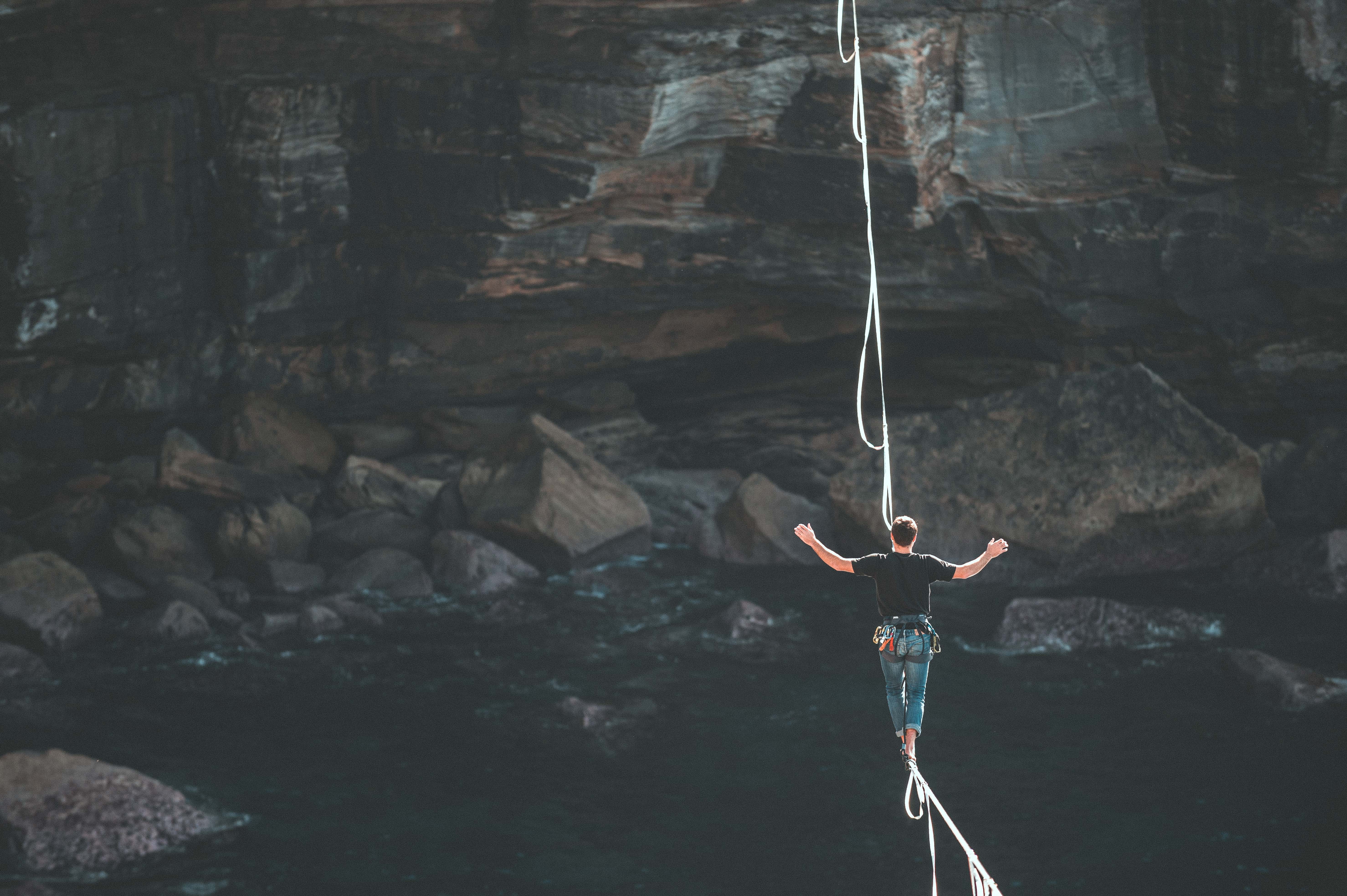 a woman walking on a tight rope to represent work life balance