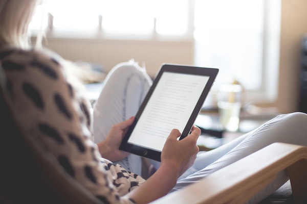 Women reading to represent how to prioritise self-care as a parent